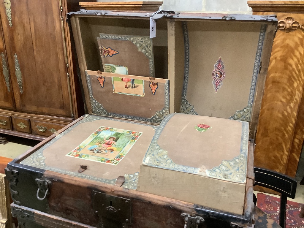 A late Victorian leather and metal mounted dome top trunk with scrap-work interior, length 76cm, depth 48cm, height 62cm